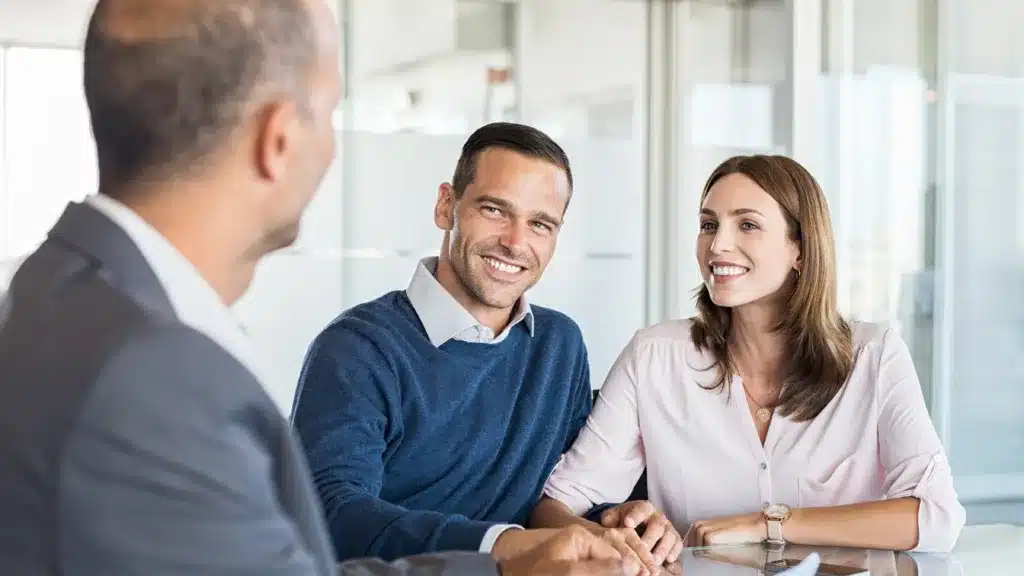 Happy Customers smiling whilst chatting in a modern office