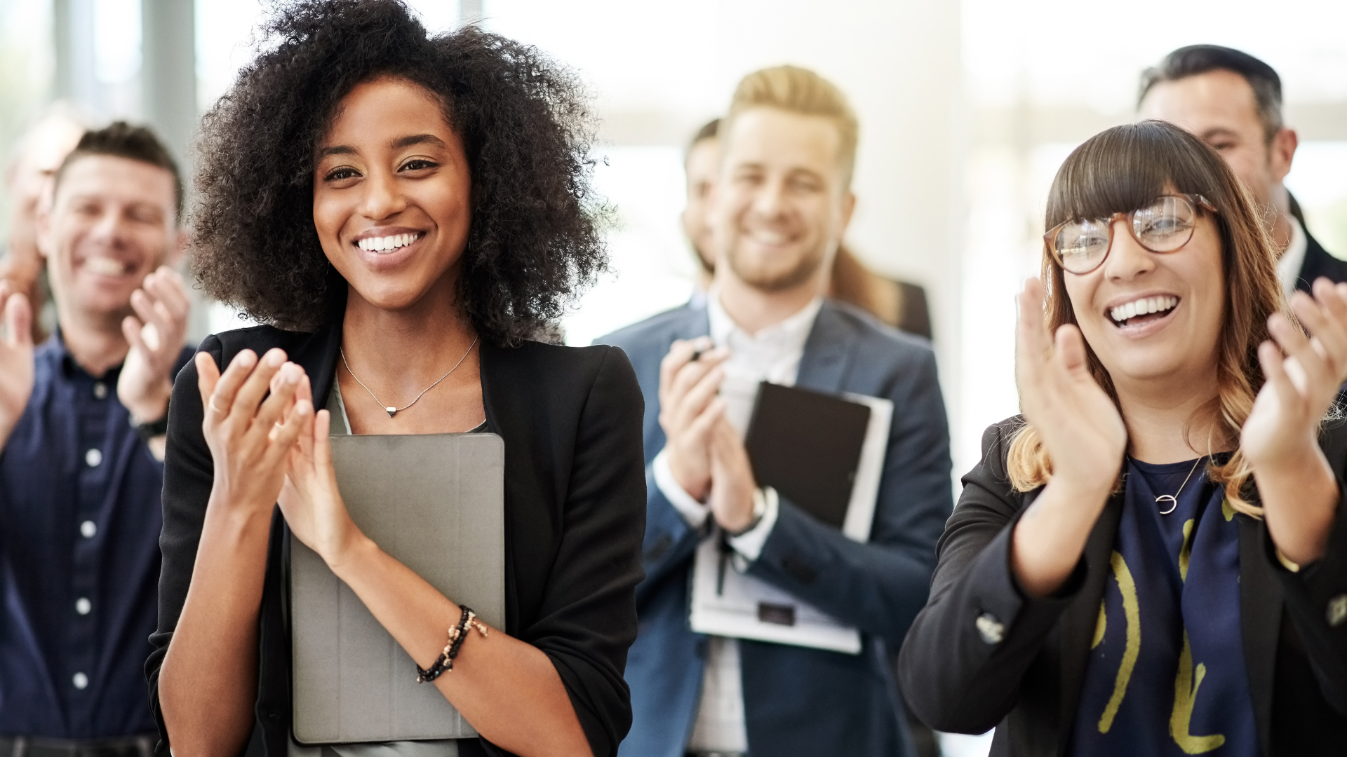 Team clapping and celebrating Employee Metrics